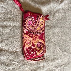 Zip around wallet. Well used. Lots of life left.